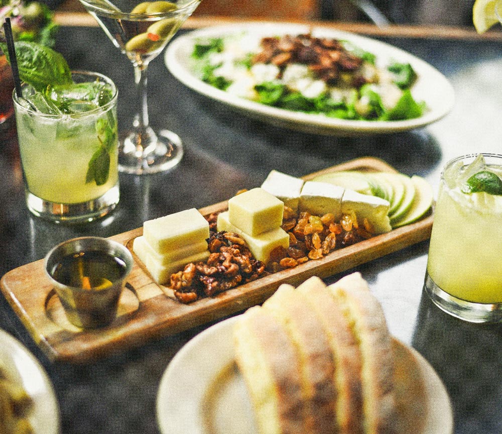 Food platter with drinks on the side.